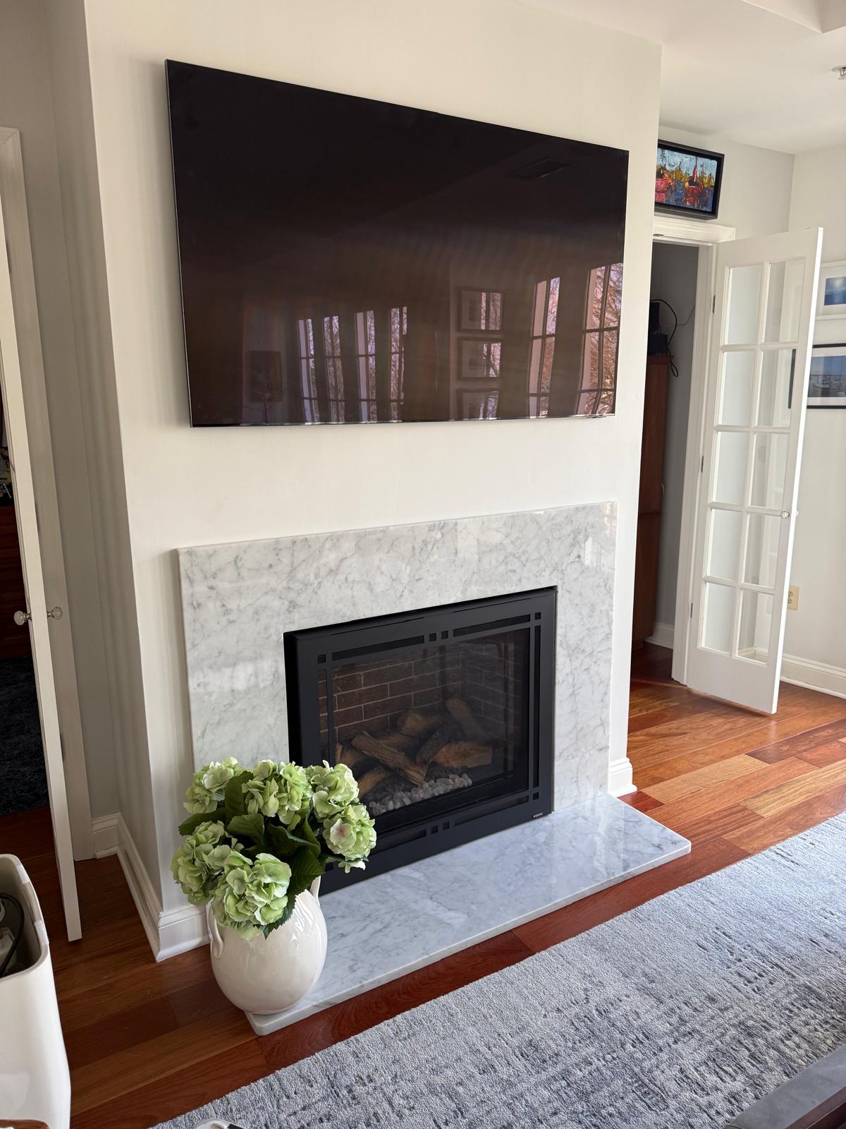 Custom polished white marble fireplace surround
