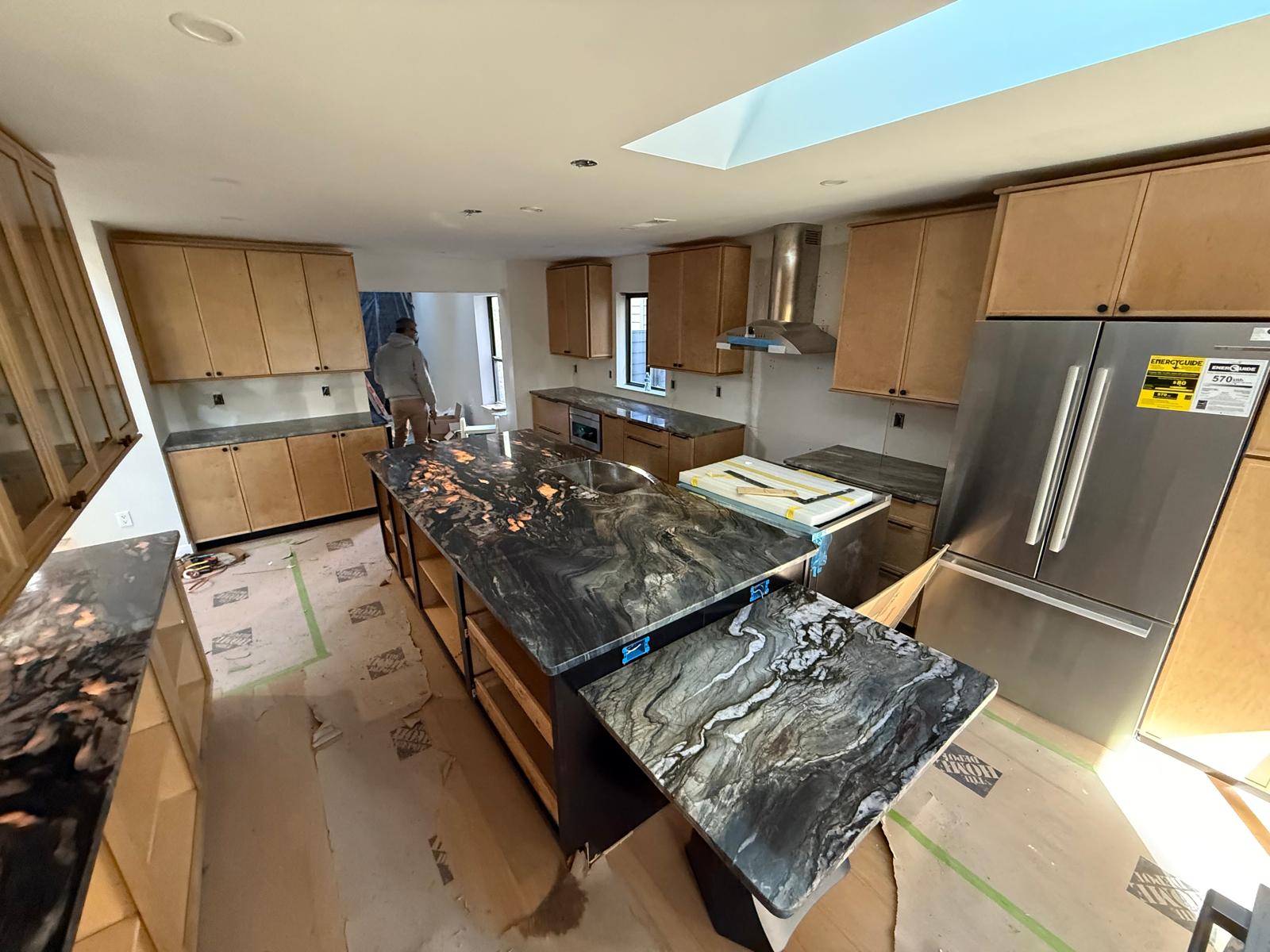 Exotic black quartzite kitchen island with gold veins
